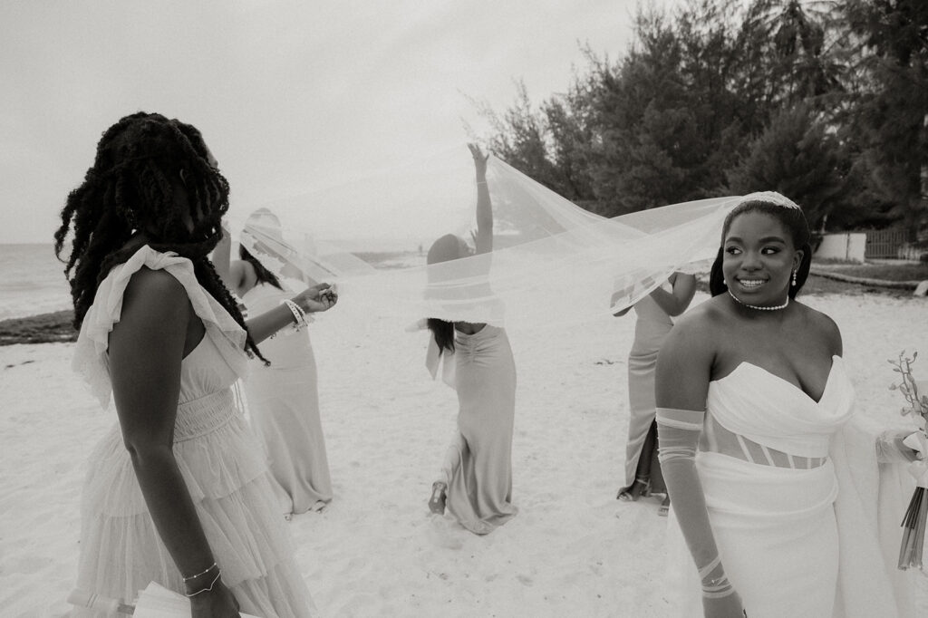 Guests enjoying cocktails and live steel pan music during sunset in Barbados
