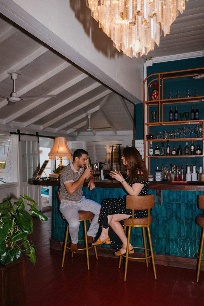 Engagement photo of a couple laughing together on a night out
