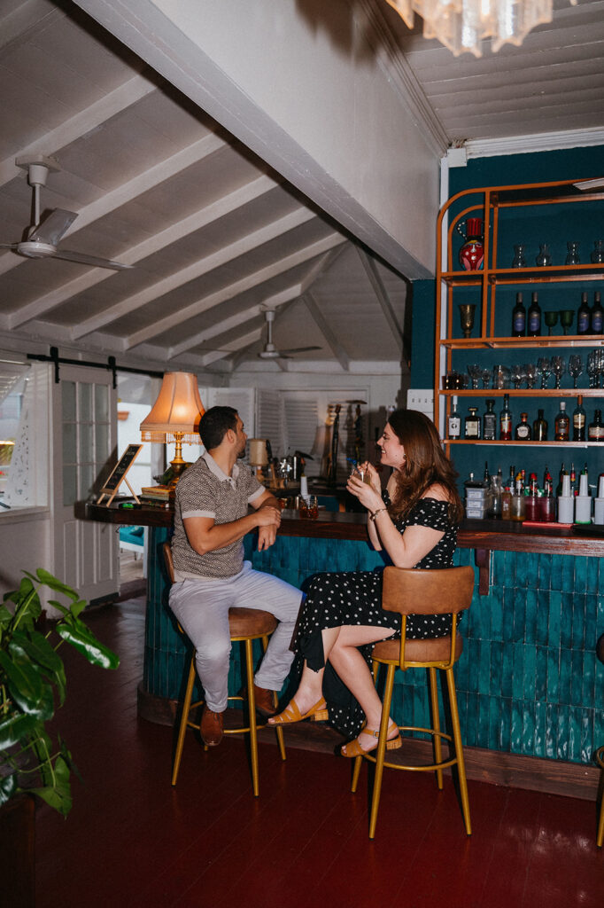 Candid flash photo of a couple dancing at a bar
