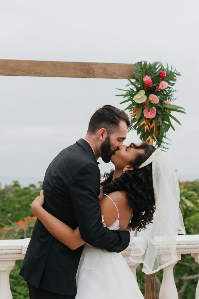 Intimate wedding ceremony with family and friends gathered outdoors
