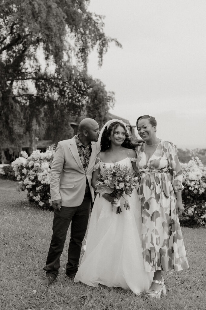 Wedding portraits in a tropical garden with colorful flowers
