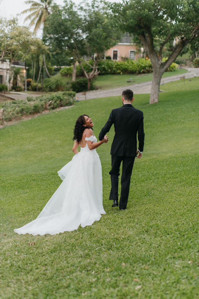 Wedding portraits in a tropical garden with colorful flowers
