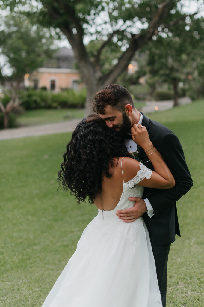 Candid photo of newlyweds laughing together on their wedding day
