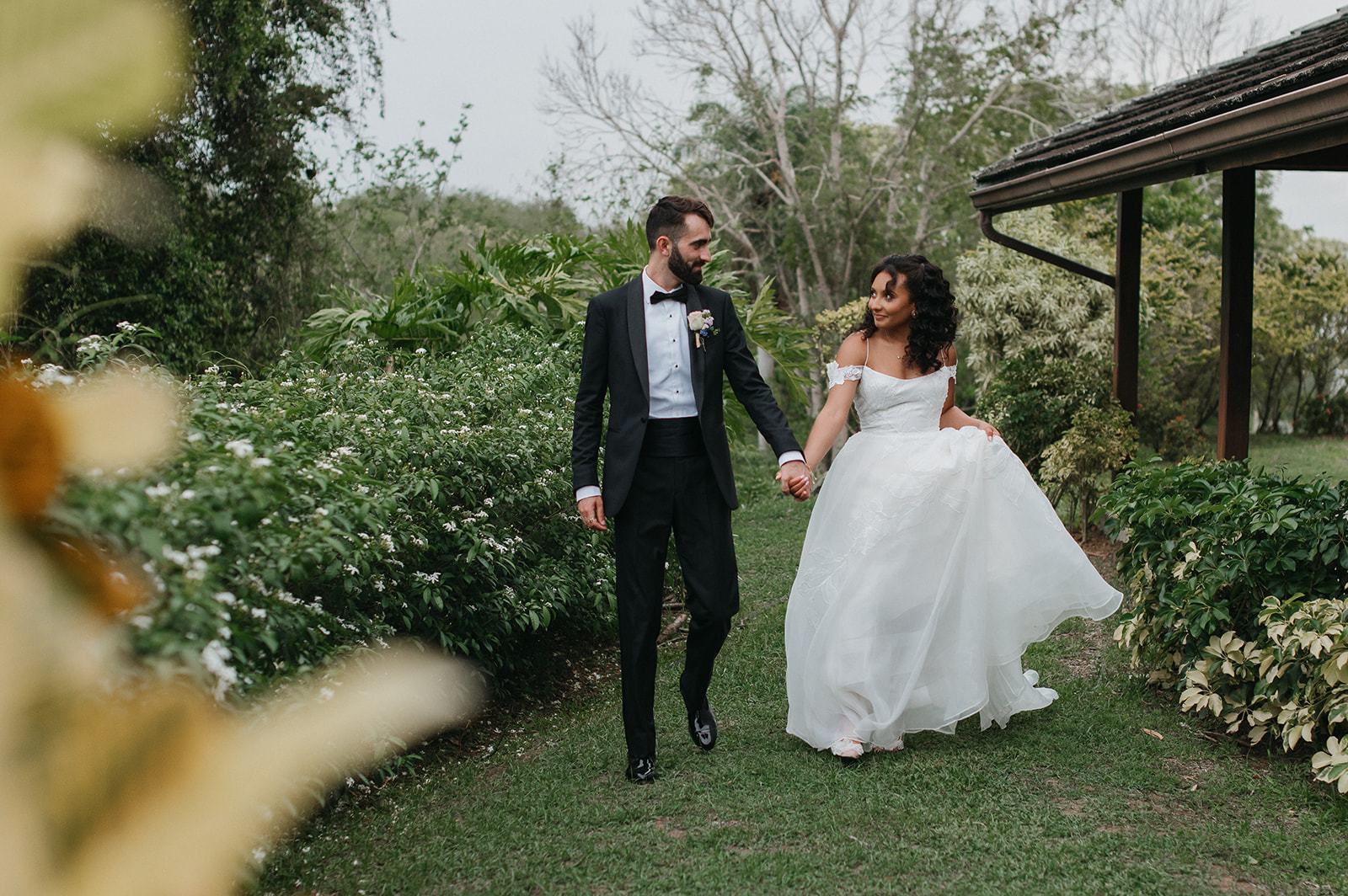 Bride and groom sharing a romantic moment during their outdoor wedding
