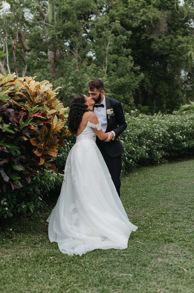Couple sharing a quiet moment away from the crowd during their wedding
