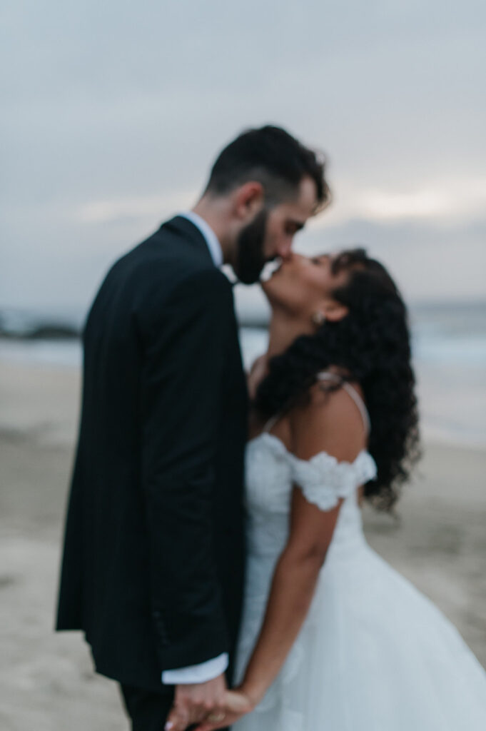 Couple sharing a quiet moment away from the crowd during their wedding
