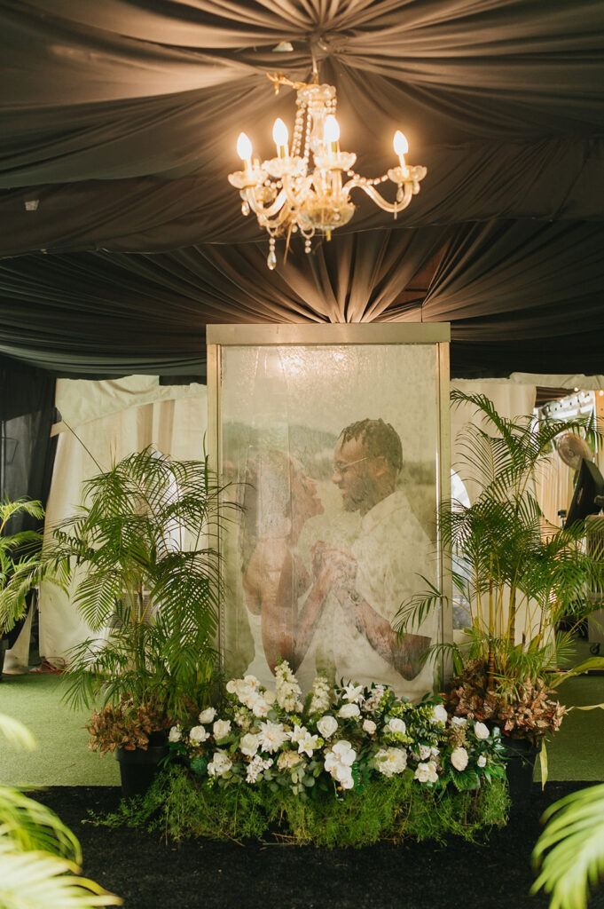 Romantic outdoor wedding ceremony surrounded by greenery.
