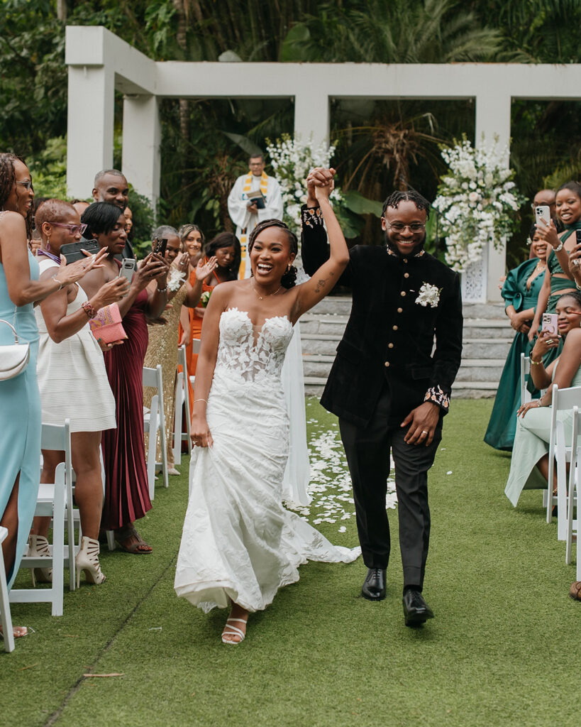 Bride and groom sharing a candid moment in the gardens of Estate 101, Trinidad.
