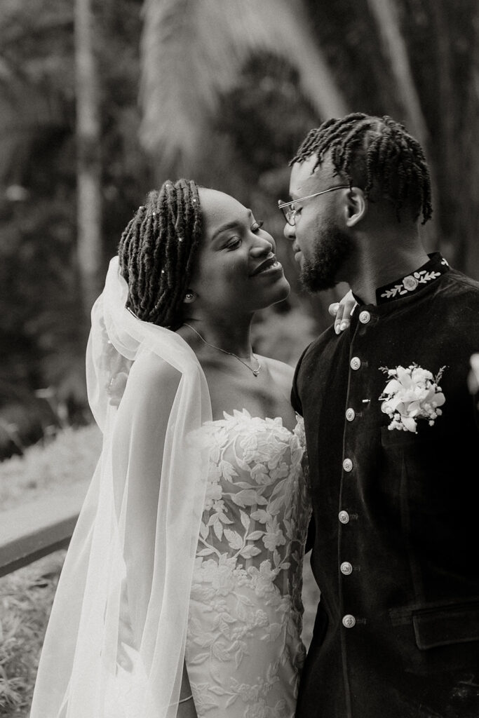 Couple walking hand in hand during portraits in the lush grounds.
