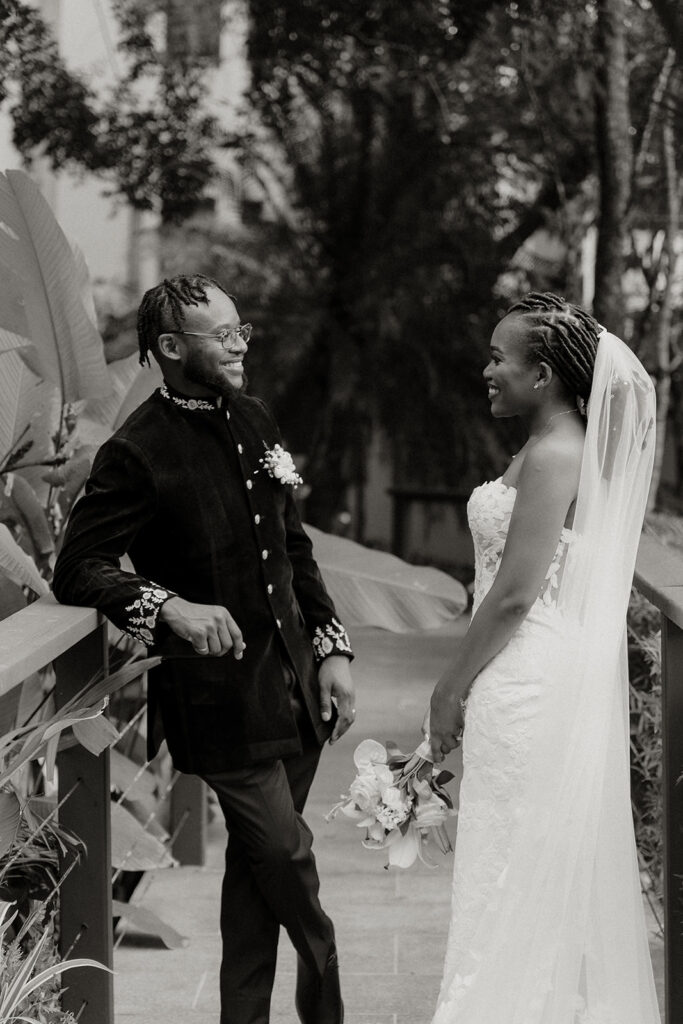 Elegant wedding portraits taken with tropical garden backdrops.
