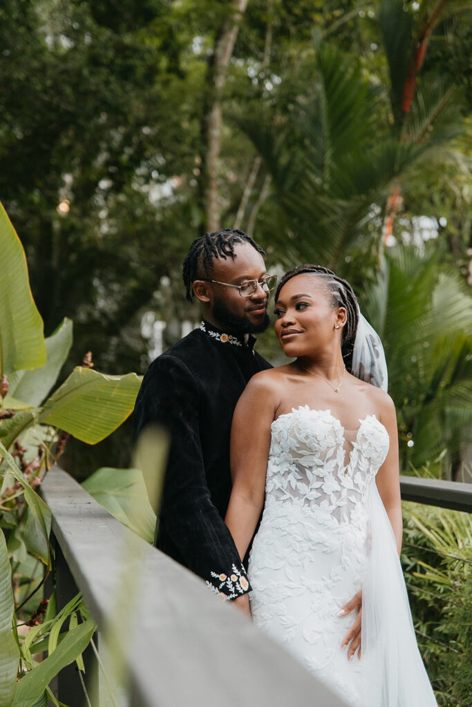 Elegant wedding portraits taken with tropical garden backdrops.
