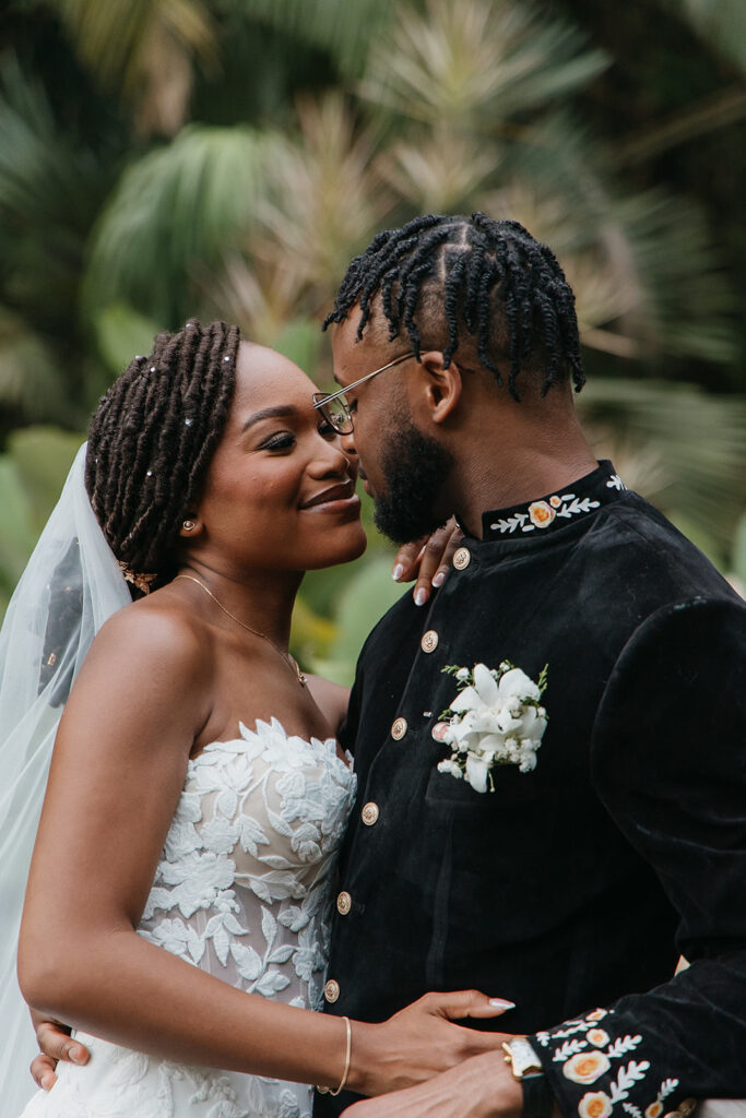 Bride and groom sharing a candid moment in the gardens of Estate 101, Trinidad.
