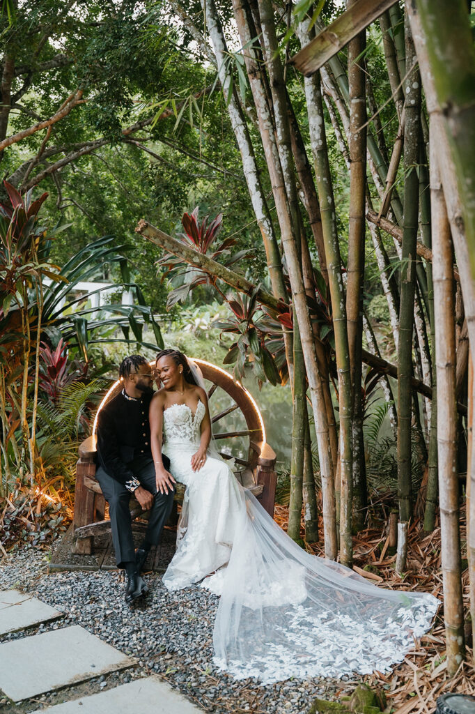 Couple walking hand in hand during portraits in the lush grounds.
