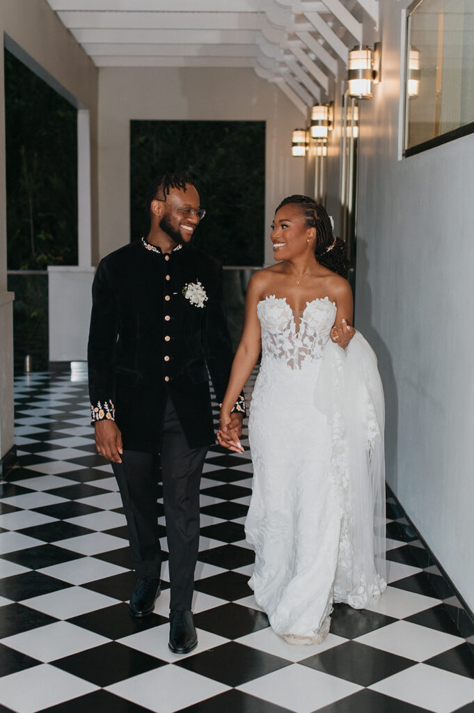 Bride and groom sharing a candid moment in the gardens of Estate 101, Trinidad.
