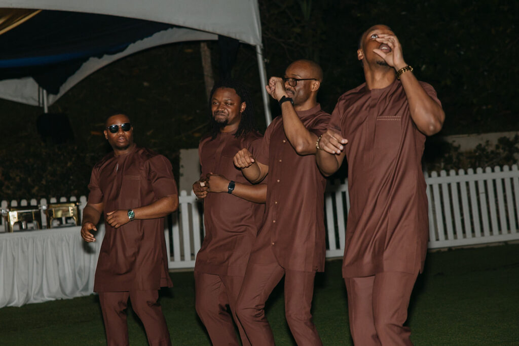 Wedding reception under the moonlight at Estate 101 with guests celebrating.
