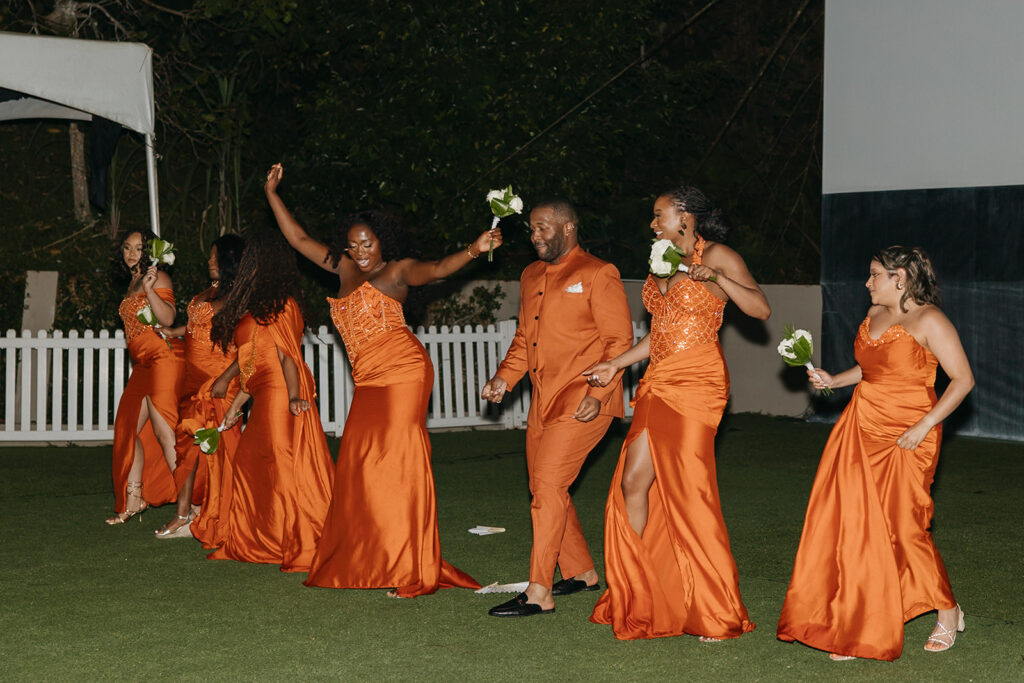 Wedding reception under the moonlight at Estate 101 with guests celebrating.
