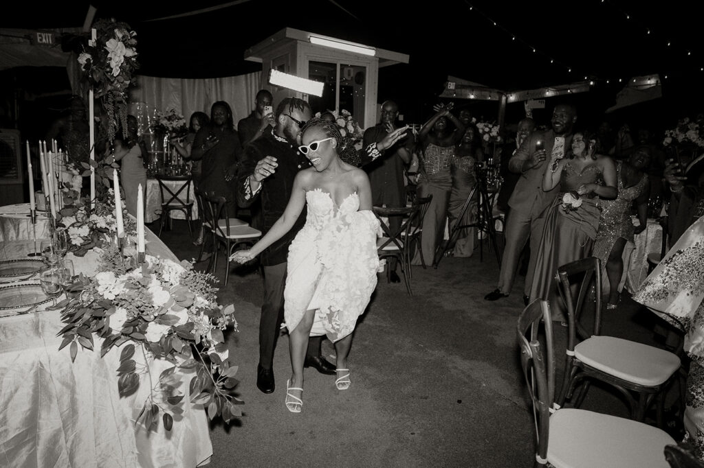Wedding reception under the moonlight at Estate 101 with guests celebrating.
