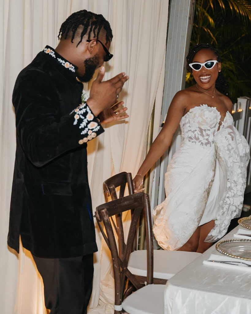 Candid laughter and joy captured during a wedding toast at Estate 101.