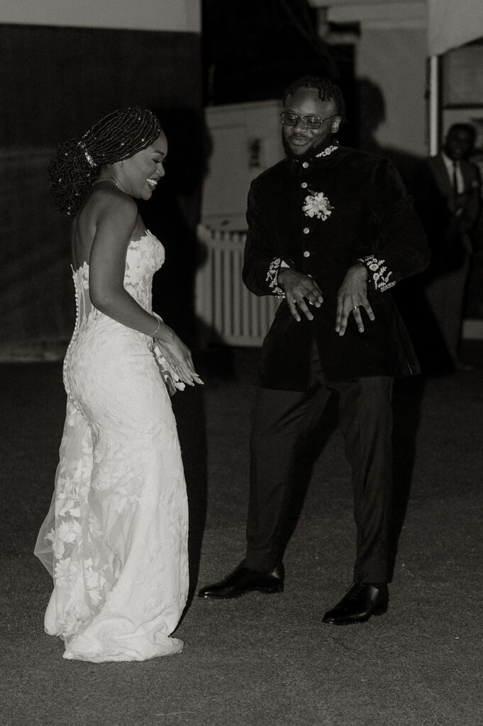 Candid laughter and joy captured during a wedding toast at Estate 101.
