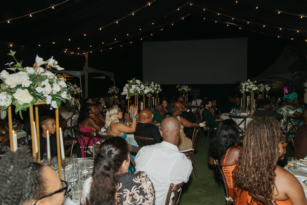 Guests gathered around outdoor tables during a wedding reception at Estate 101.