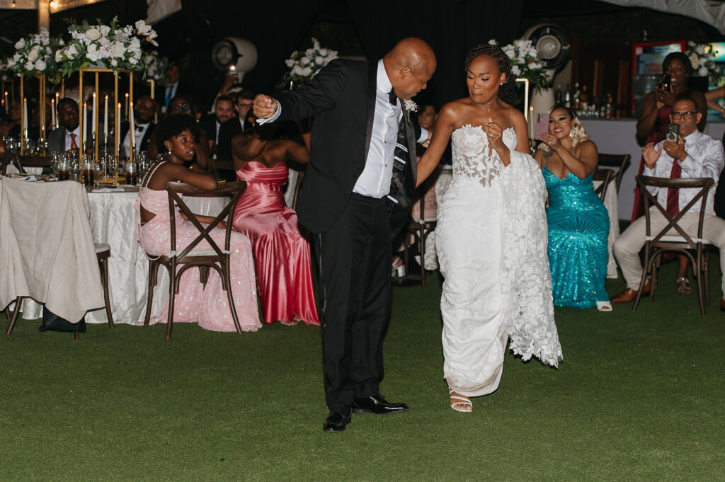 Wedding reception under the moonlight at Estate 101 with guests celebrating.
