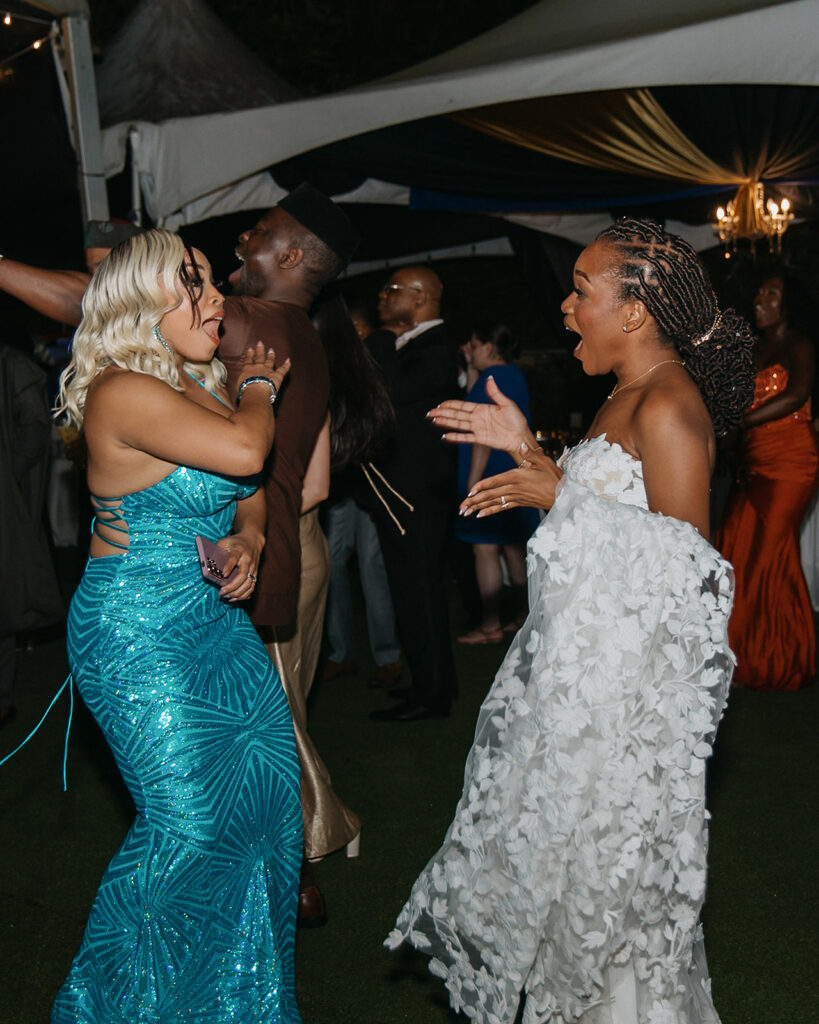 Friends and family celebrating on the dance floor during the wedding reception.