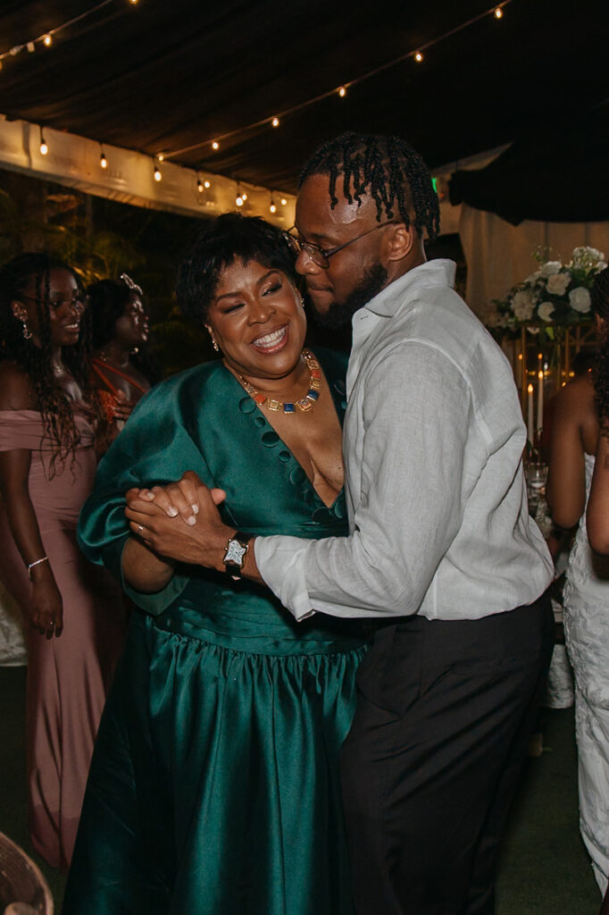 Friends and family celebrating on the dance floor during the wedding reception.