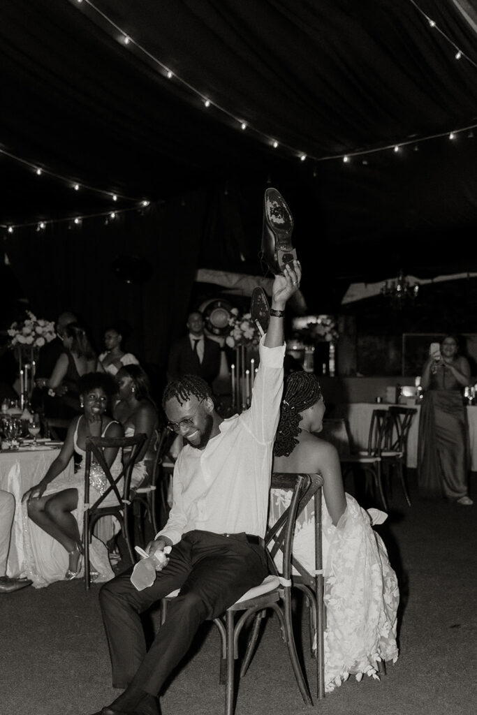 Friends and family celebrating on the dance floor during the wedding reception.