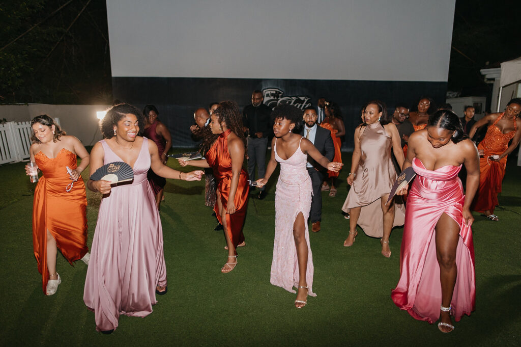 Wedding reception under the moonlight at Estate 101 with guests celebrating.
