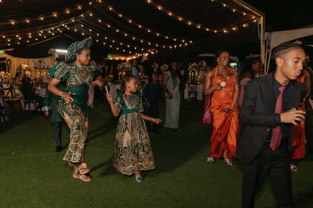 Wedding reception under the moonlight at Estate 101 with guests celebrating.
